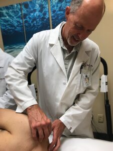 Dr. Von der Muhll performing acupuncture at the teaching clinic of the Academy of Chinese Culture and Health Sciences.